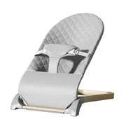Gray baby high chair with quilted design on a white background